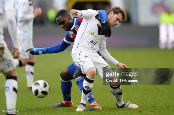 Eder Balanta of Basel and Mario Piccinocchi of Lugano battle for the ball during the Raiffeisen Super League match between FC Basel and FC Lugano at...