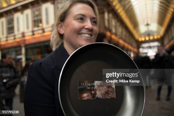 Shrove Tuesday festivities as The City Flippers, celebrate winning the Leadenhall Market Pancake Day Race on 13th February 2018 in London, United...