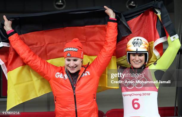 Natalie Geisenberger of Germany celebrates winning the gold medal with silver medalist Dajana Eitberger of Germany during the Luge Women's Singles on...