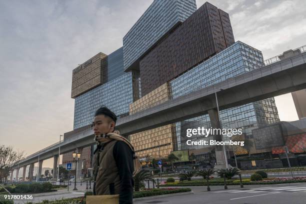 Pedestrian walks past the MGM Cotai casino resort, developed by MGM China Holdings Ltd., in Macau, China, on Tuesday, Feb. 13, 2018. MGM Resorts...