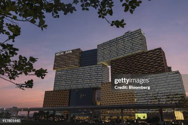 The MGM Cotai casino resort, developed by MGM China Holdings Ltd., left, stands in Macau, China, on Tuesday, Feb. 13, 2018. MGM Resorts...