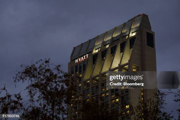 Signage is displayed on the exterior of the Manchester Grand Hyatt Hotel at night in San Diego, California, U.S., on Sunday, Feb. 11, 2018. Hyatt...