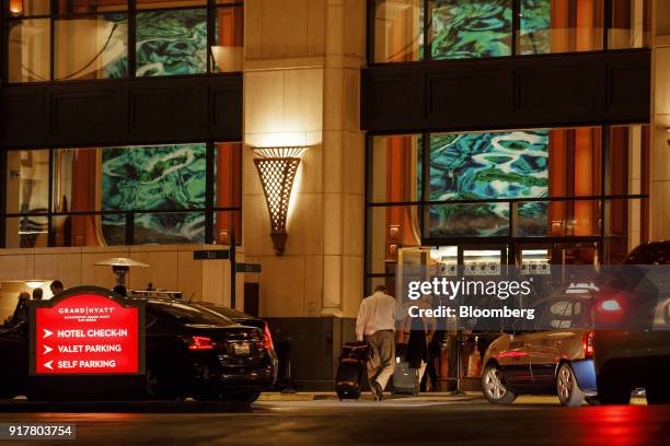 Visitors enter the Manchester Grand Hyatt Hotel in San Diego, California, U.S., on Sunday, Feb. 11, 2018. Hyatt Hotels Corp. Is scheduled to release...