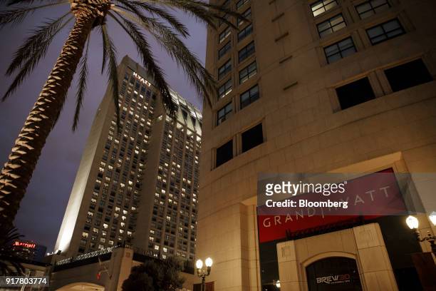 Signage is displayed outside the Manchester Grand Hyatt Hotel at night in San Diego, California, U.S., on Sunday, Feb. 11, 2018. Hyatt Hotels Corp....