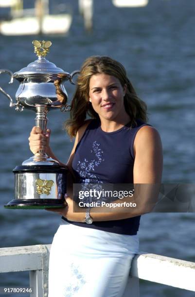 Jennifer Capriati of the USA celebrates with the trophy on the waterfront next to the Yarra River after defeating Martina Hingis of Switzerland in...