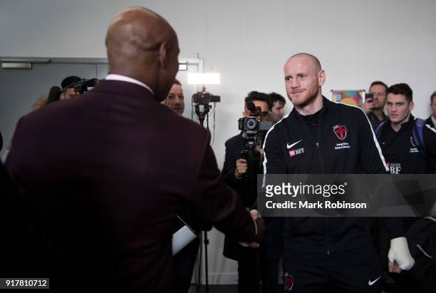 George Groves shakes hands with Chris Eubank before he takes part in a public work out at National Football Museum on February 13, 2018 in...