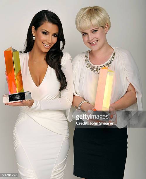 Personalities Kim Kardashian and Kelly Osbourne pose for a portrait at Hollywood Life's 6th Annual Hollywood Style Awards held at the Armand Hammer...