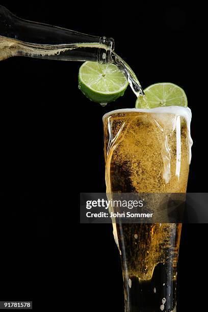 pouring beer - overflowing beer stock pictures, royalty-free photos & images