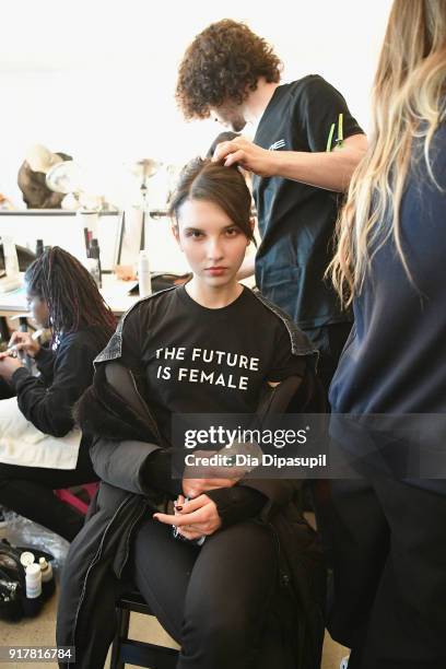 Model prepares backstage at Badgley Mischka during New York Fashion Week: The Shows at Gallery I at Spring Studios on February 13, 2018 in New York...