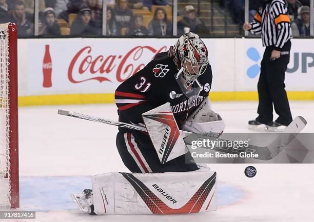 Northeastern University's Cayden Primeau makes a save against Boston University during the third period. Northeastern University faces Boston...