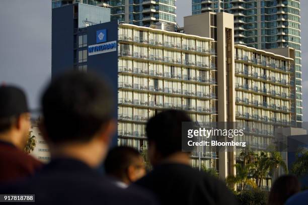 Pedestrians pass in front of the Wyndham San Diego Bayside hotel in San Diego, California, U.S., on Sunday, Feb. 11, 2018. Wyndham Worldwide Corp. Is...