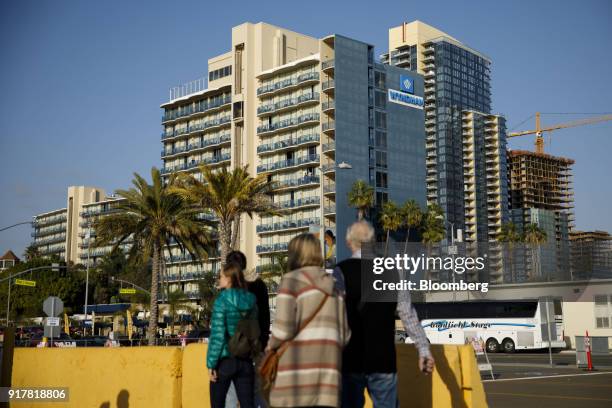 Pedestrians pass in front of the Wyndham San Diego Bayside hotel in San Diego, California, U.S., on Sunday, Feb. 11, 2018. Wyndham Worldwide Corp. Is...