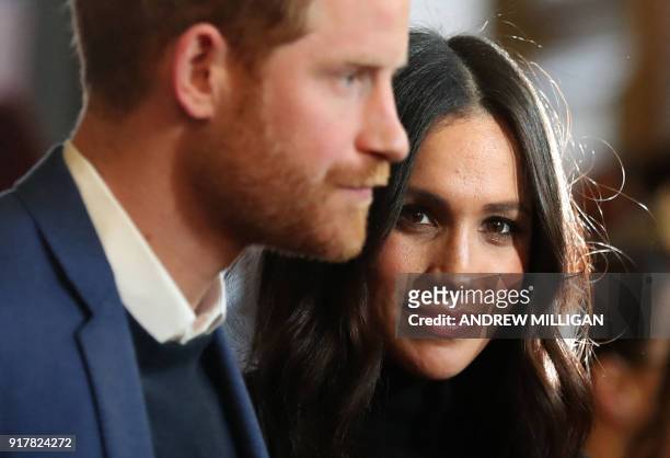 Britain's Prince Harry and his fiancée US actress Meghan Markle attend a reception for young people at the Palace of Holyroodhouse in Edinburgh,...