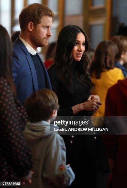 Britain's Prince Harry and his fiancée US actress Meghan Markle attend a reception for young people in the Palace of Holyroodhouse in Edinburgh,...