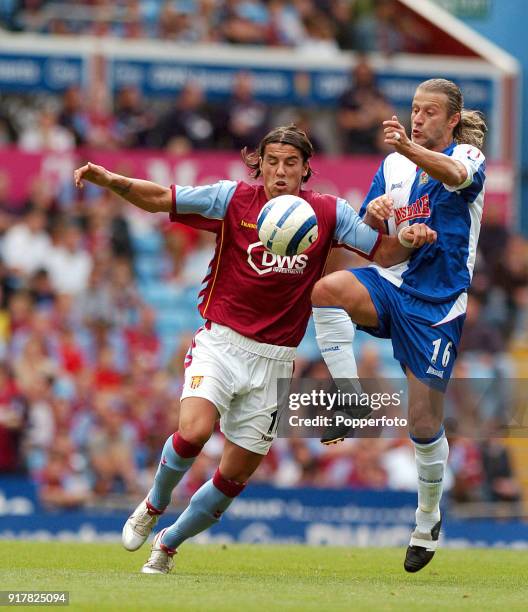 Milan Barros of Aston Villa battles with Tugay of Blackburn during the FA Barclays Premiership match between Aston Villa and Blackburn Rovers at...