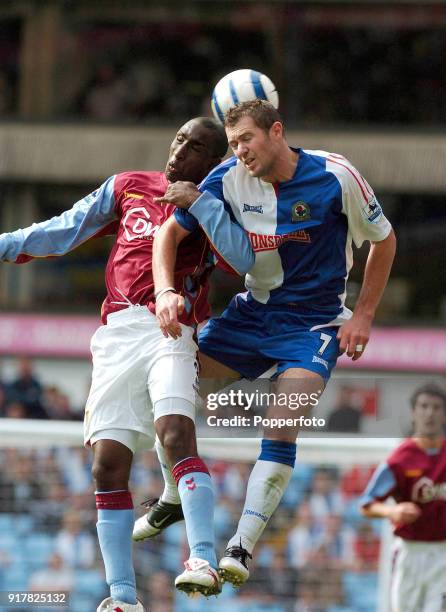 Jlloyd Samuel of Aston Villa and Brett Emerton of Blackburn Rovers in action during the FA Barclays Premiership match between Aston Villa and...