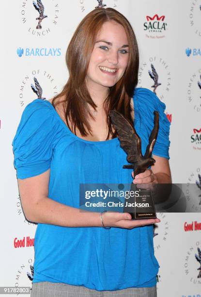 Emily Cummins poses with her sustainable designer award as she attends the Women of the Year Lunch at Intercontinental Hotel on October 12, 2009 in...