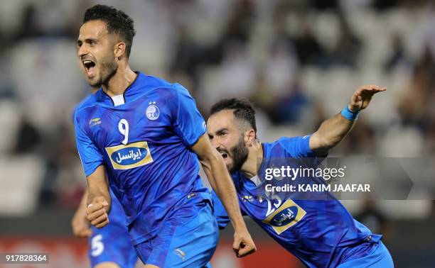 Esteghlal FC's Iranian forward Ali Ghorbani celebrates with his teammates after scoring a goal against Al-Rayyan SC during their Asian Champions...