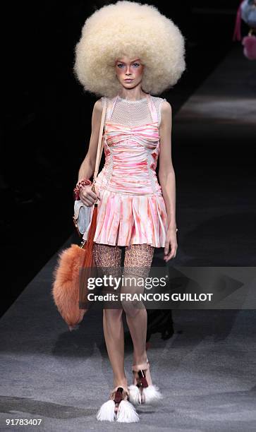 A model wears an outfit by US fashion designer Marc Jacobs for