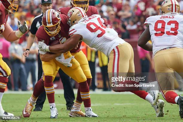 Washington Redskins quarterback Kirk Cousins battles with San Francisco 49ers defensive end Solomon Thomas during a NFL football game between the San...