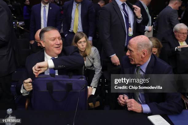 Central Intelligence Agency Director Mike Pompeo and Director of National Intelligence Dan Coats talk following an open hearing of the Senate...