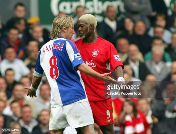 Djibril Cisse of Liverpool and Robbie Savage of Blackburn Rovers clash during the Barclays Premiership match between Liverpool and Blackburn Rovers...