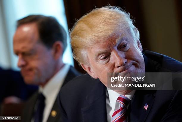 President Donald Trump meets with members of Congress, including and Senator Pat Toomey , R-PA, on trade in the Cabinet Room of the White House on...