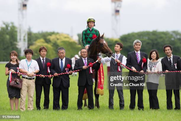 Jockey Yoshitomi Shibata, trainer Naosuke Sugai and owner Akatsuki Yamatoya celebrate after Just A Way winning the Yasuda Kinen at Tokyo Racecourse...