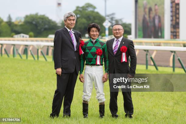 Jockey Yoshitomi Shibata, trainer Naosuke Sugai and owner Akatsuki Yamatoya celebrate after Just A Way winning the Yasuda Kinen at Tokyo Racecourse...