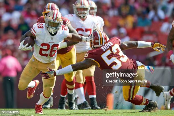 San Francisco 49ers running back Carlos Hyde battles with Washington Redskins linebacker Zach Brown during a NFL football game between the San...