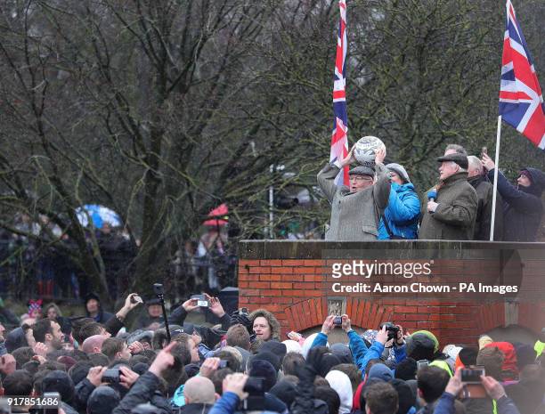 William Tucker throws the ball to the players during the annual Royal Shrovetide football match in Ashbourne, Derbyshire which takes place over two...