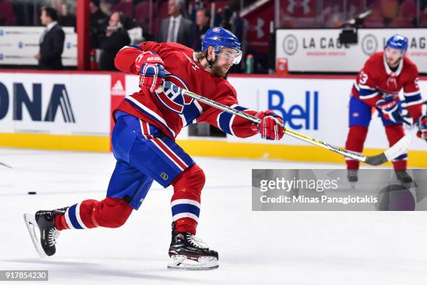 Joe Morrow of the Montreal Canadiens takes a shot during the warm-up prior to the NHL game against the Nashville Predators at the Bell Centre on...