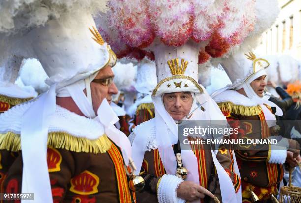 Performers dressed as a "Gilles", the oldest and principal participants in the Carnival of Binche in Belgium, wearing their white feather hats and...