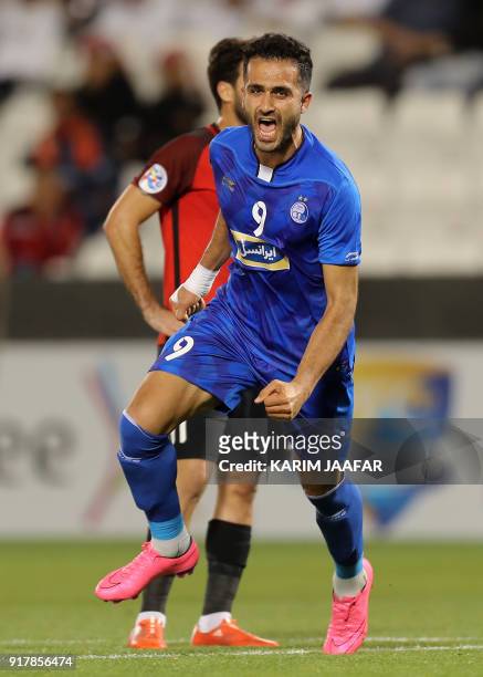 Esteghlal FC's Iranian forward Ali Ghorbani celebrates after scoring a goal against Al-Rayyan SC during their Asian Champions League football match...