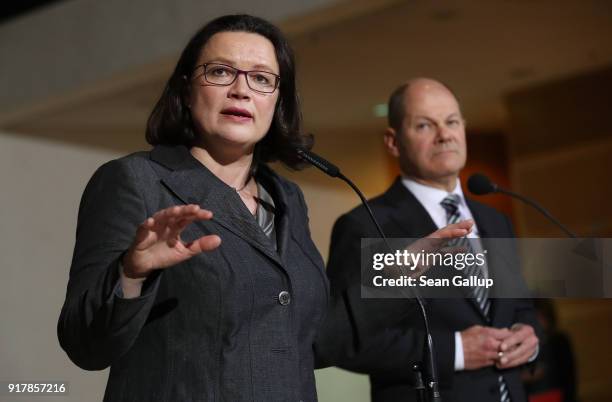 Andrea Nahles, head of the Bundestag faction of the German Social Democrats , and SPD leading member Olaf Scholz speak to the media following the...