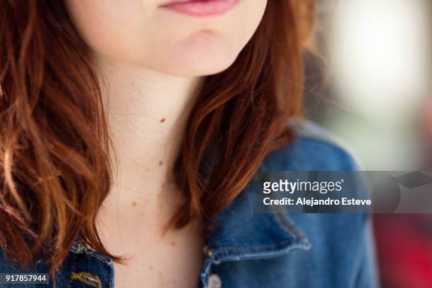 close-up of a redhead girl (neck with moles and chin) - mole stock pictures, royalty-free photos & images