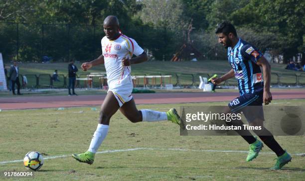 Players of Minerva Punjab FC and East Bengal tussle for the ball in an I-League match at Tau Devi Lal Stadium on February 13, 2018 in Panchkula,...