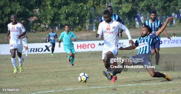 Players of Minerva Punjab FC and East Bengal tussle for the ball in an I-League match at Tau Devi Lal Stadium on February 13, 2018 in Panchkula,...