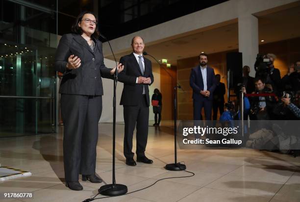 Andrea Nahles, head of the Bundestag faction of the German Social Democrats , and SPD leading member Olaf Scholz speak to the media following the...