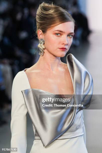 Vlada Roslyakova walks the runway wearing Badgley Mischka Fall 2018 at Gallery I at Spring Studios on February 13, 2018 in New York City.