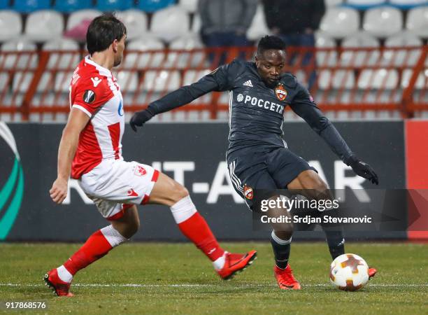 Ahmed Musa of CSKA Moscow in action against Filip Stojkovic of Crvena Zvezda during UEFA Europa League Round of 32 match between Crvena Zvezda...