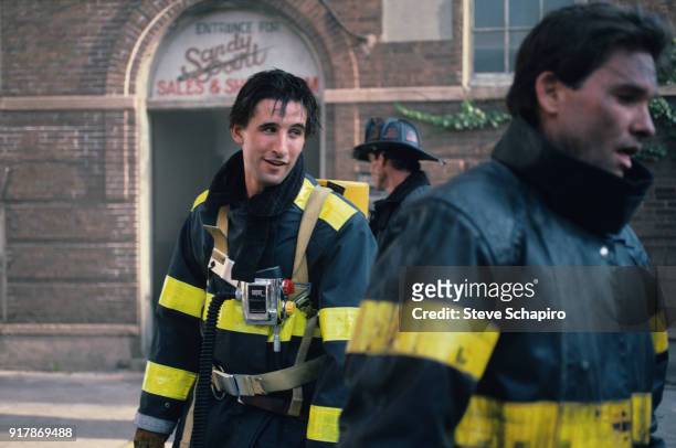 American actor William Baldwin on the set of the film 'Backdraft' , Los Angeles, California, 1990. The other actors are unidentified.