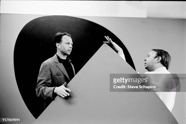 American artist Ellsworth Kelly and curator Henry Geldzahler stand together in a gallery, New York, 1965.