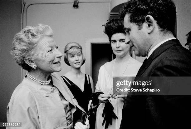 Backstage at Carnegie Hall, American journalist Mary Hemingway speaks with author Norman Mailer , New York, New York, May 31, 1963. Among the women...
