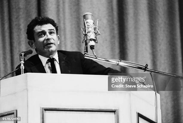 American author Norman Mailer speaks onstage at Carnegie Hall speaks from a lectern onstage at Carnegie Hall, New York, New York, May 31, 1963.