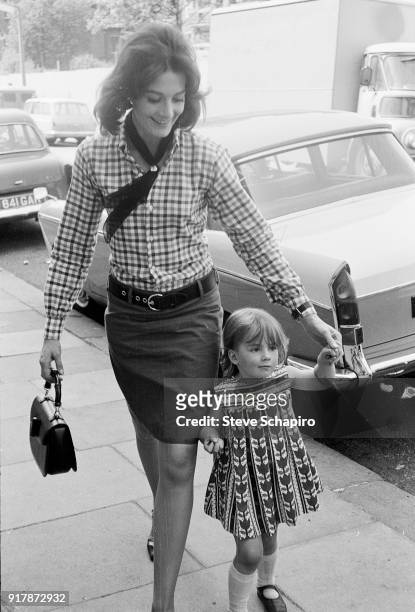 English actress Vanessa Redgrave walks with her daughter Natasha Richardson on the set of the film 'Blow-Up' , London, England, 1965.