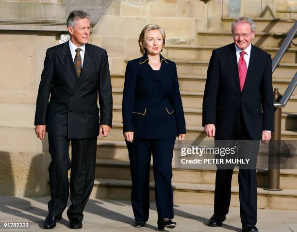Secretary of State Hillary Clinton leaves Stormont Castle in Belfast, on Monday October 12 with Northern Ireland's First Minister Peter Robinson and...