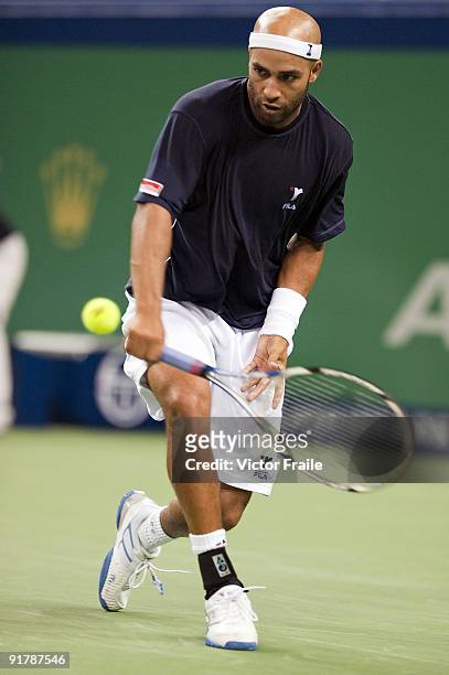 James Blake of USA returns a shot to Ivo Karlovic of Croatia during day two of 2009 Shanghai ATP Masters 1000 at the Qi Zhong Tennis Centre in...