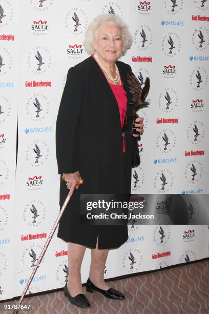 Dame Vera Lynn poses with her Woman of the Year Award as she attends the Women of the Year Lunch at Intercontinental Hotel on October 12, 2009 in...