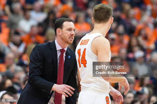 Assistant coach Gerry McNamara of the Syracuse Orange talks with Braedon Bayer against the Wake Forest Demon Deacons during the first half at the...